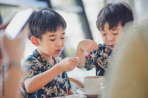 Little boy child enjoy eating. photo