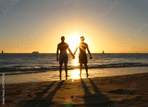 Gay couple Silhouette on the beach sunset