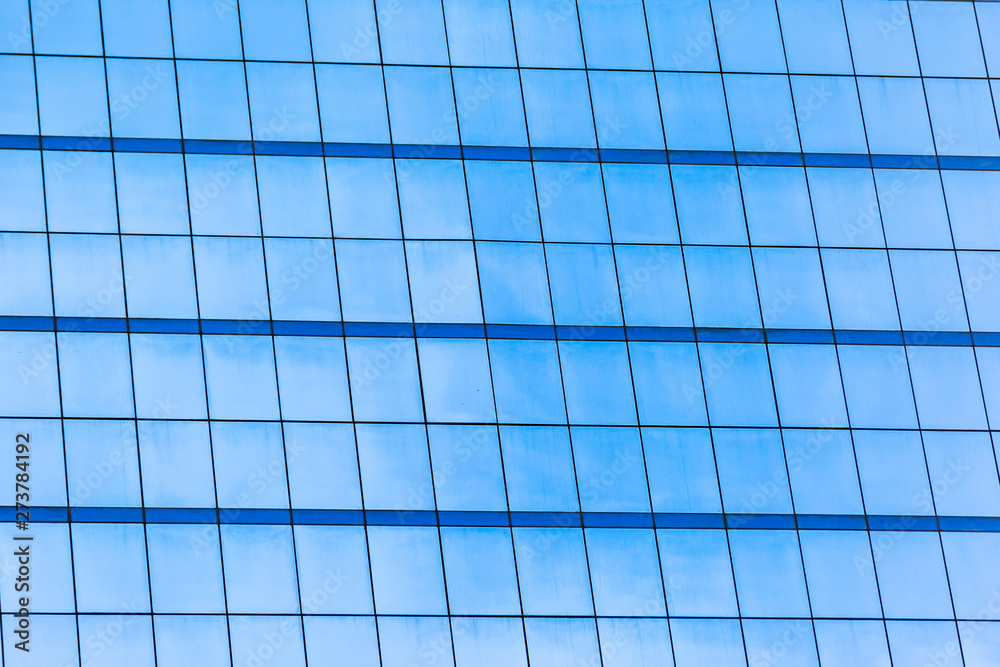 Blue glass windows of office building Blue glass windows of office building