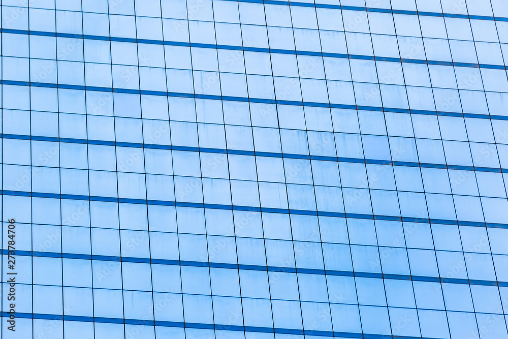Blue glass windows of office building Blue glass windows of office building