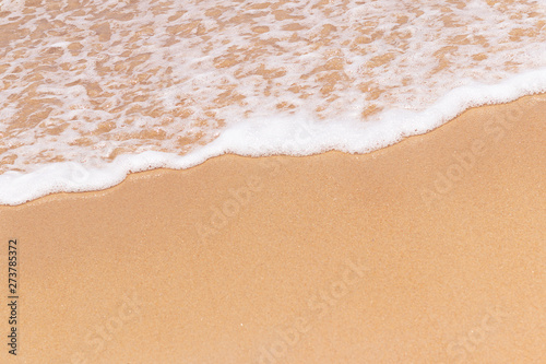 close up beautiful beach and foam of wave summer nature background