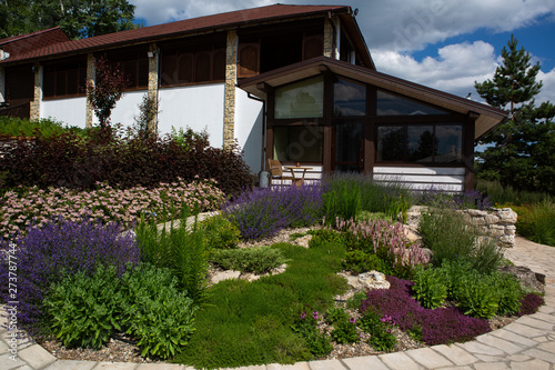 house with well-kept garden. Landscape design