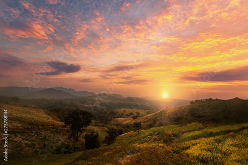 Beautiful sunset or sunrise with colorful sky over the hills