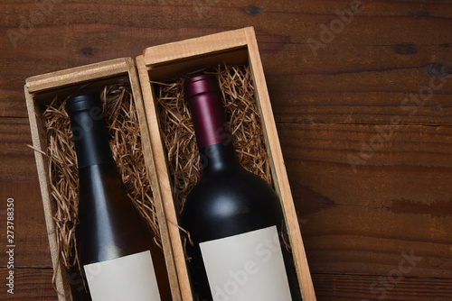 A bottle of Chardonnay and Cabernet Sauvignon wine in wood gift boxes © Steve Cukrov