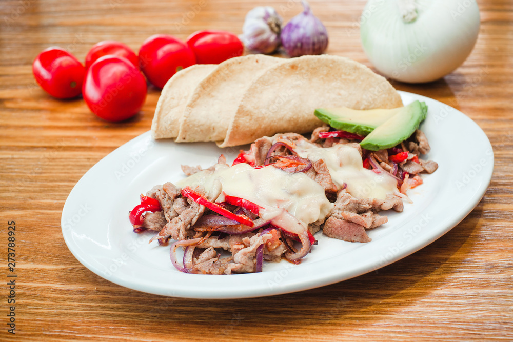 Mexican food, Alambre is made with Beef, onion, bacon, chili, cheese and tortillas in Mexico