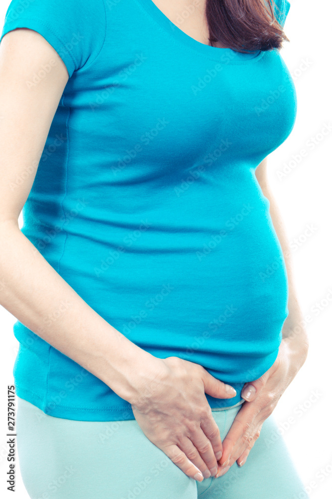 Pregnant woman with hands on her stomach, pregnancy health care and bladder aches Pregnant woman with hands on her stomach, pregnancy health care and bladder aches