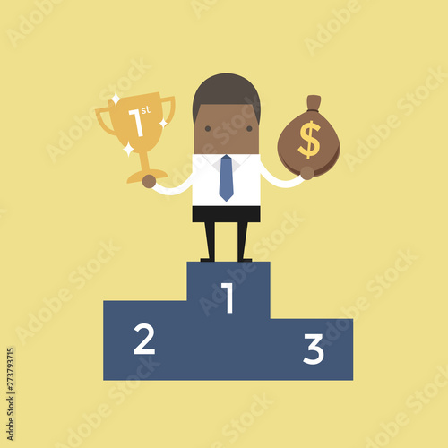 African businessman standing on the winning podium holding trophy and a bag of money.