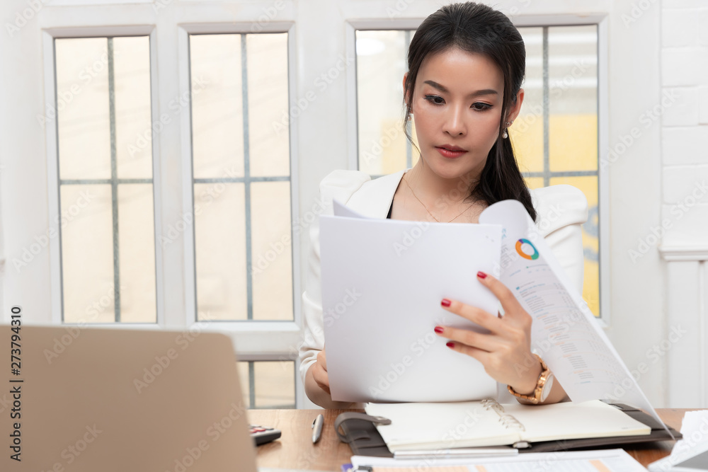 Business and finance concept of office working, Businesswoman discussing sale analysis Chart Business and finance concept of office working, Businesswoman discussing sale analysis Chart