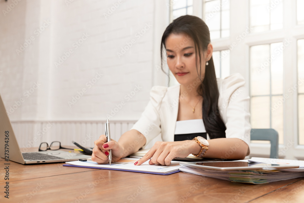 Business and finance concept of office working, Businesswoman discussing sale analysis Chart Business and finance concept of office working, Businesswoman discussing sale analysis Chart