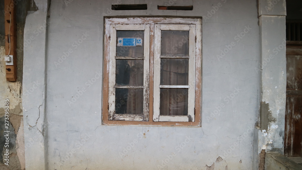 Old Window Frame on the crack grey wall