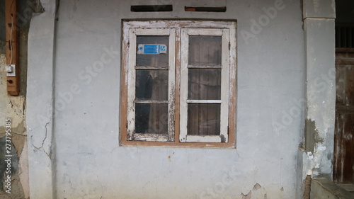 Old Window Frame on the crack grey wall