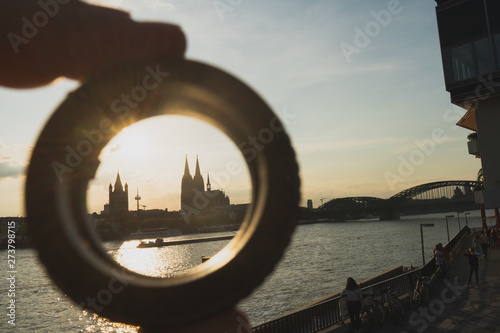 Cologne cityscape and landscape and skyline during sunset trough a ring objective