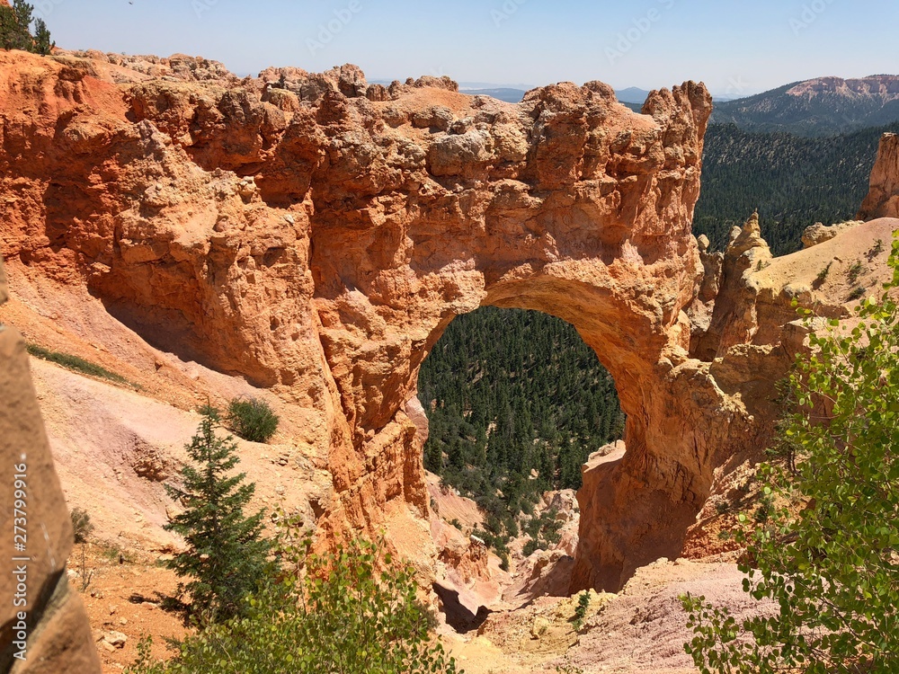 Scenic Natural Bridge, an 85-foot arch carved out of sedimentary red rock at Bryce Canyon National Park in Utah.