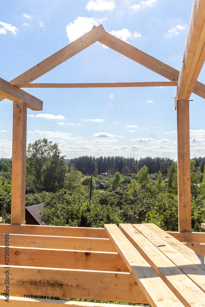 wooden interior frame of a new house under building, architectural residential construction stick built home framework. wooden interior frame of a new house under building, architectural residential construction stick built home framework.