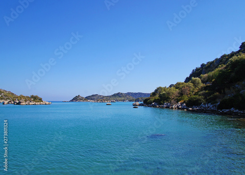 Blue lagoon with sky. Seashore against the backdrop of a beautiful landscape. © Payllik
