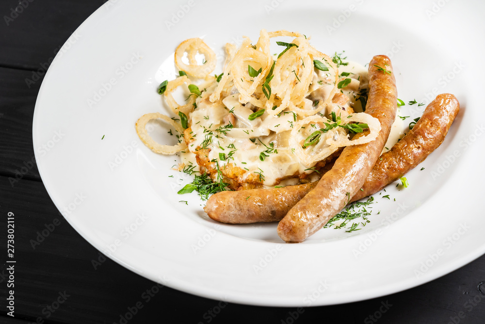 potato pancakes with sausages and fried onion potato pancakes with sausages and fried onion