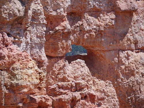 Close up of a hole through the red rock wall at at Black Birch Canyon, Bryce Canyon National Park in Utah.