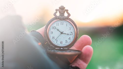 An old pocket watch in your hand