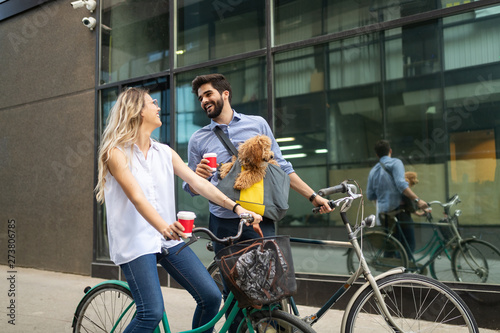 Couple in love with dog walking and smiling outdoor