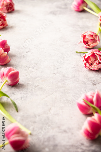 Spring flowers and Easter decorations on shabby chic background