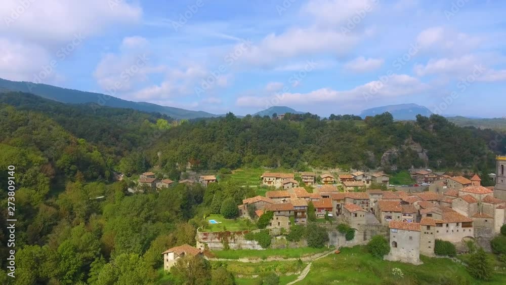 Full panorama from above of Rupit village located on on a part of a small rocky hill. the houses and the old town are old but very well preserved. Catalonia, Spain. Full panorama from above of Rupit village located on on a part of a small rocky hill. the houses and the old town are old but very well preserved. Catalonia, Spain.