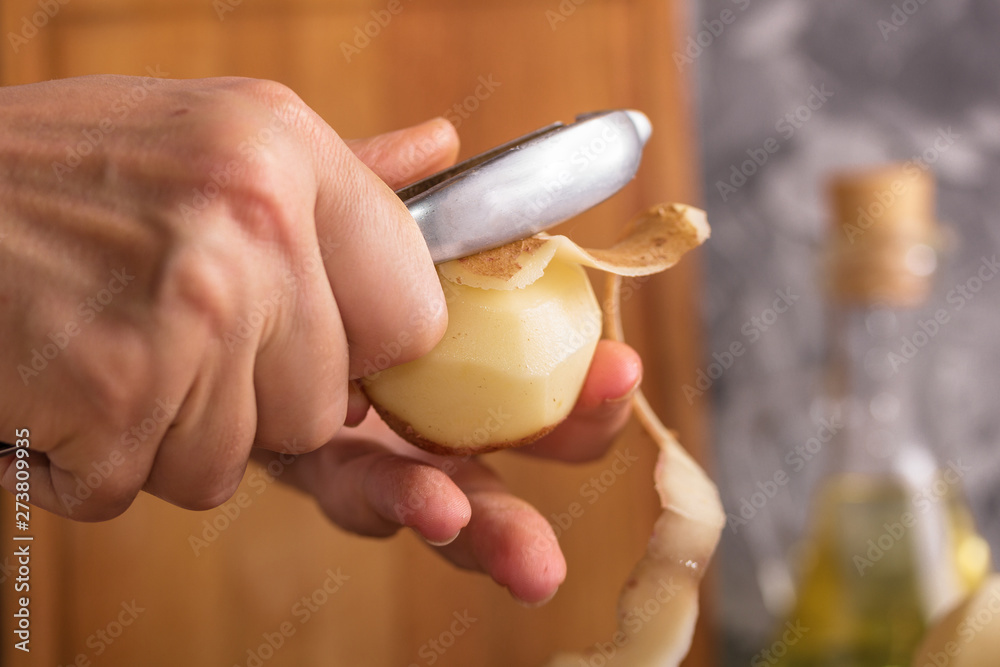 Cook cleans onions with a knife close-up. Organic cooking concept. Cook cleans onions with a knife close-up. Organic cooking concept.