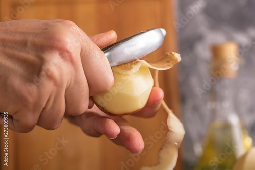 Wallpaper Mural Cook cleans onions with a knife close-up. Organic cooking concept. Torontodigital.ca