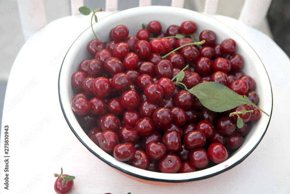 Fresh cherry in the rustic metal bowl Fresh cherry in the rustic metal bowl