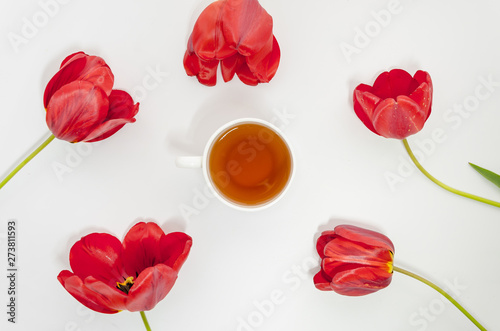 Flat lay tea composition with flowers