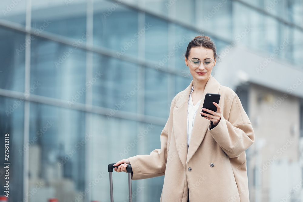 . Business woman at international airport moving to terminal gate for airplane travel trip - Mobility concept and aerospace industry flight connections . Business woman at international airport moving to terminal gate for airplane travel trip - Mobility concept and aerospace industry flight connections