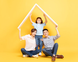 happy asian family  in new house with roof concept