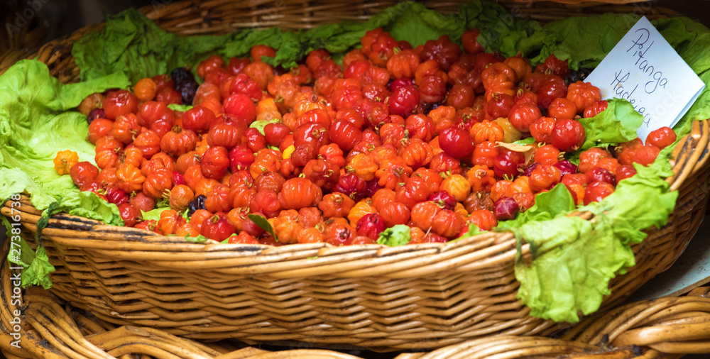 Basket of fresh pitanga fruit