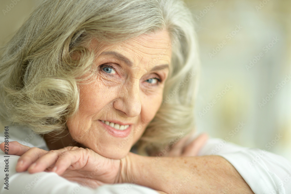 Beautiful smiling senior woman posing at home Beautiful smiling senior woman posing at home