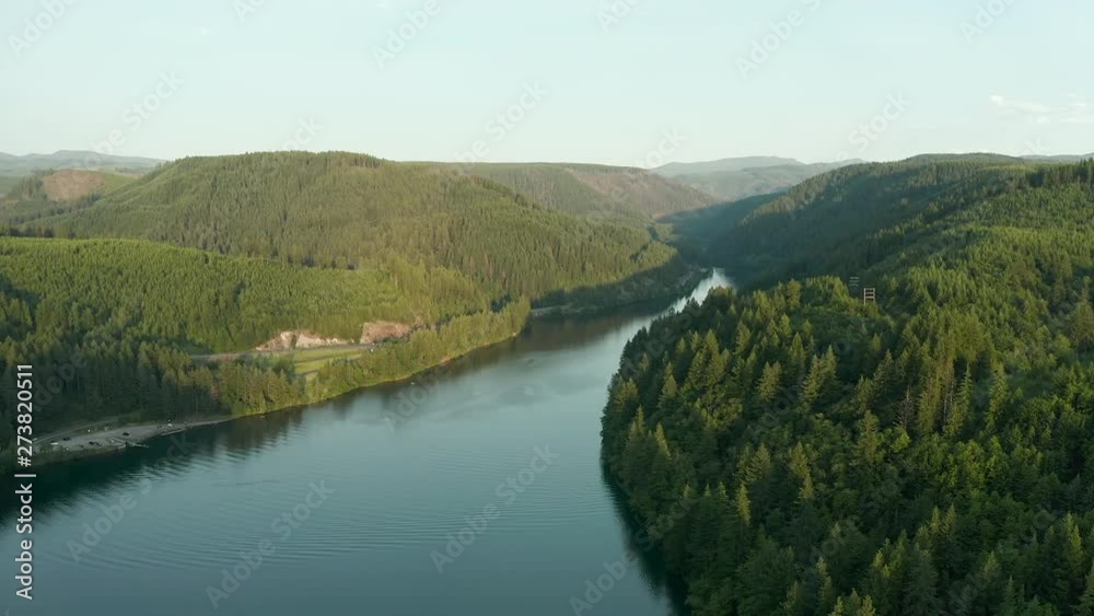 Clackamas River with green forest during a sunset. Clackamas River with green forest during a sunset.