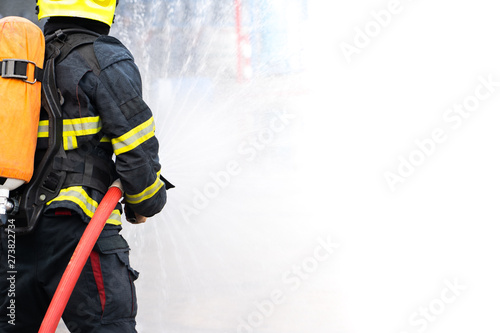 firefighters spray water on white background