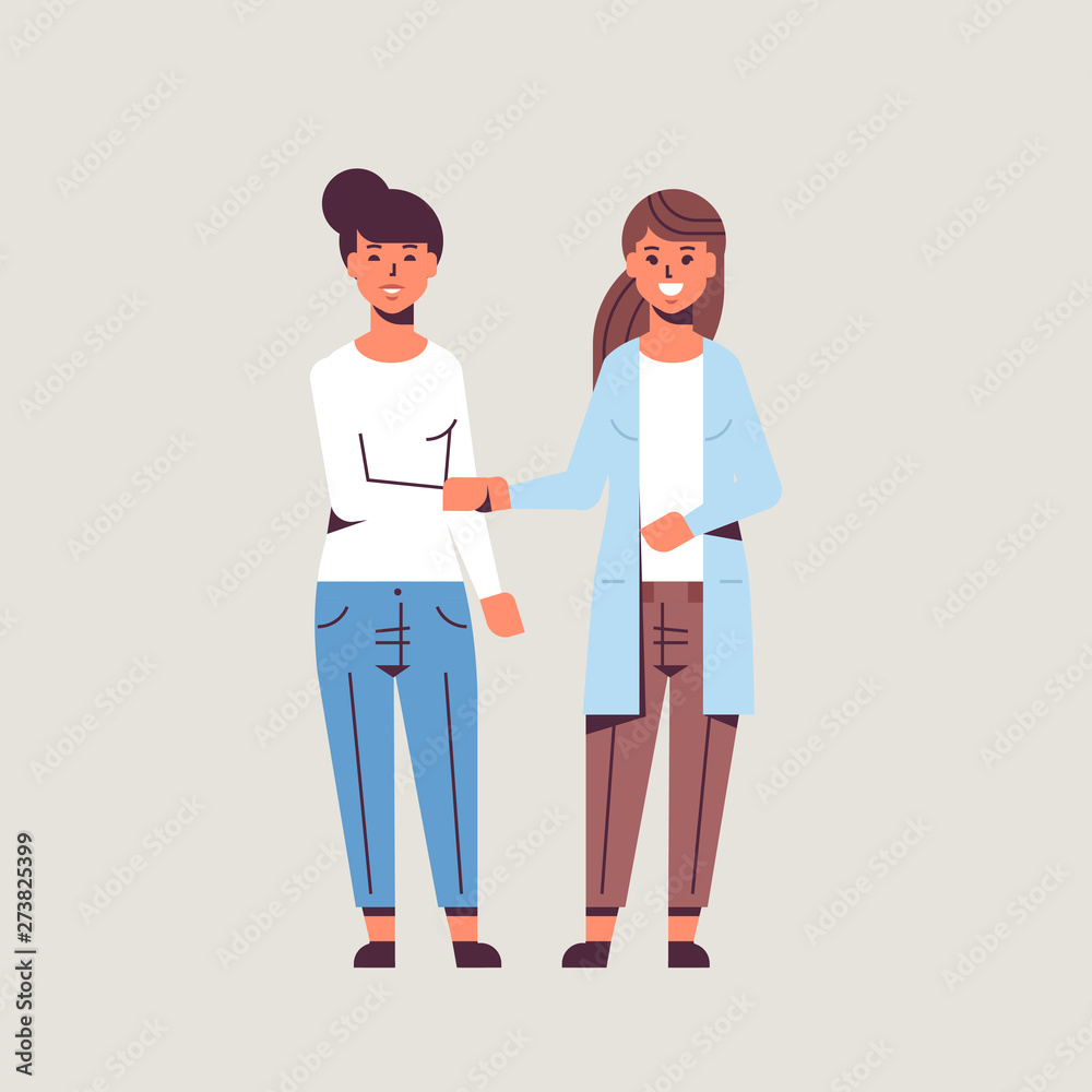 Obraz premium businesswomen handshaking business partners couple hand shake during meeting agreement partnership concept female colleagues standing together flat full length
