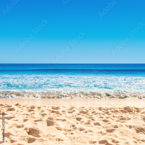 Blue ocean wave on sandy beach.  Tropical  Summer Vacation concept .