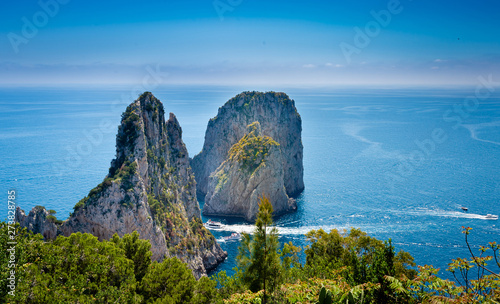 Faraglioni rocks view from Giardini di Augusto in Capri, Italy. photo