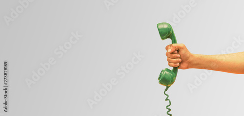 Εκτύπωση καμβά Old phone receiver in hand, businessman holding The old phone receiver, banner b