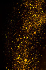 Gold glitter dust dark abstract background