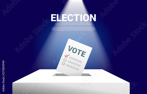 vote paper put in election box. concept for election vote theme background.