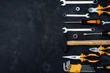 construction tools in wooden box in black background