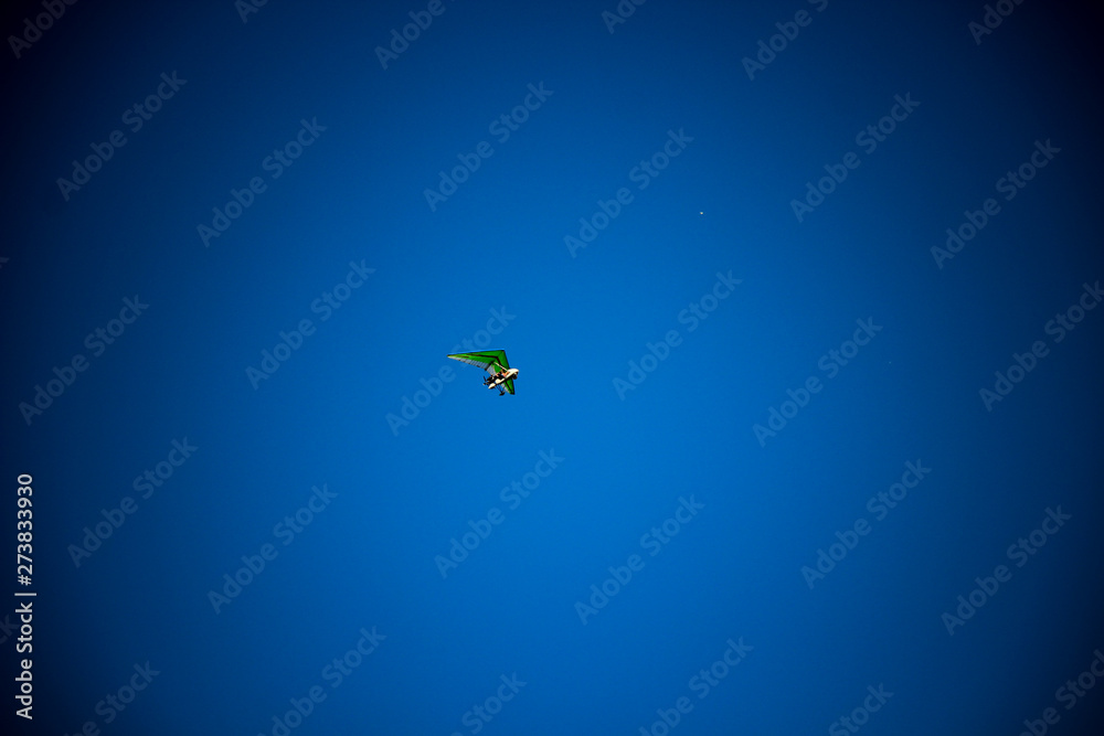Fototapeta premium Motorized glider in blue sky