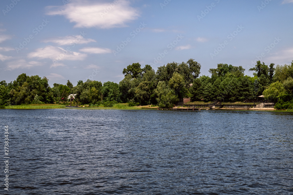 Fototapeta premium Walking throught the Dnipro river in Kyiv city, Ukraine. Landscapes and views from the boat