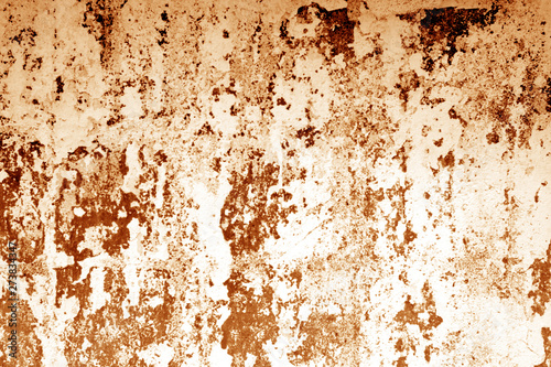 Сraked weathered cement wall texture in orange tone.