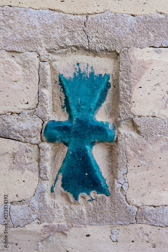 Oriental blue, green tile in a brick wall