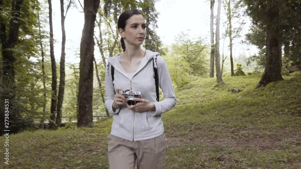 Girl walking in nature and taking pictures Girl walking in nature and taking pictures