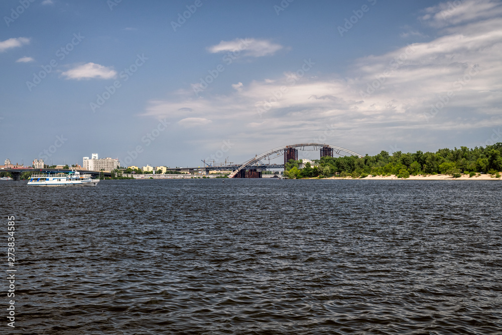 Walking throught the Dnipro river in Kyiv city, Ukraine. Landscapes and views from the boat