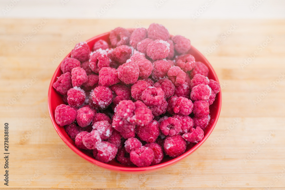 Frozen fresh raspberries on a plate. Frozen fresh raspberries on a plate.