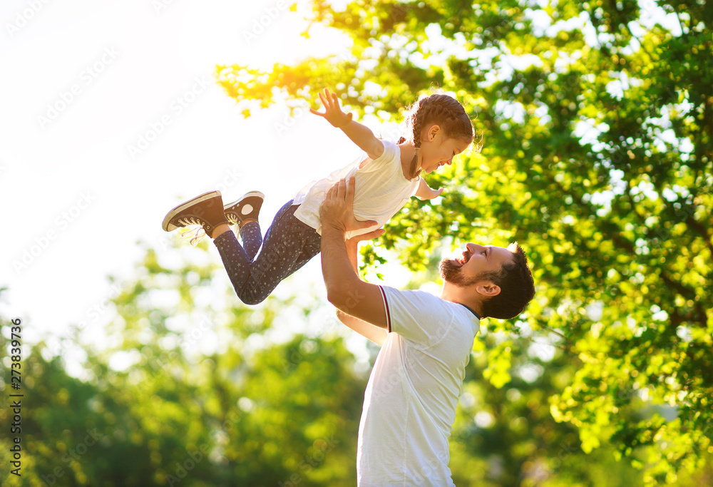 concept of father's day! happy family dad and child daughter    in nature. - obrazy, fototapety, plakaty 